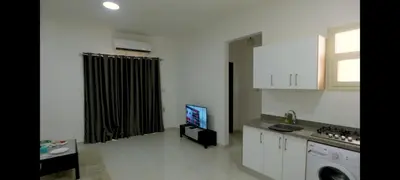 a kitchen with a sink and a tv in a room at La bonita compound in Hurghada