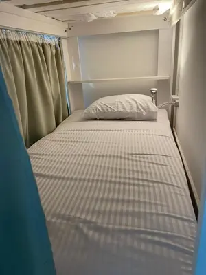 a small bed in the back of a trailer at Serafy City Center Hostel for Foreigners Adults Only in Hurghada