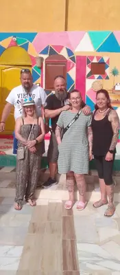 a group of people posing for a picture at Kamel House in Aswan