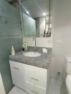 a bathroom with a sink and a toilet at Scandic Resort in Hurghada