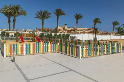 a playground with colorful gates in a park with palm trees at Scandic Resort in Hurghada, EGYPT in Hurghada