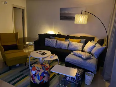 a living room with a couch and a table at Mangroovy Tasteful 1 bedroom in Hurghada