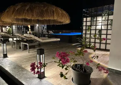 a pavilion with a table with flowers on it at 3BR 2BA Retreat with Four Pools Gym and Onsite Dining Close to El Gouna in Hurghada