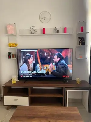 a flat screen tv sitting on top of a table at Brand new studio at G-Cribs ElGouna in Hurghada