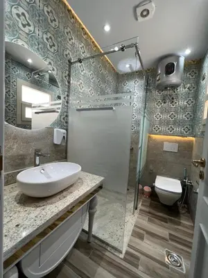 a bathroom with a sink and a shower and a toilet at BS Lodging 15 - Next to Dream Beach in Hurghada