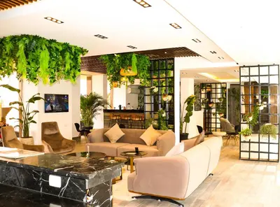 a lobby with a couch and chairs and a table at 2 Bed Resort Apt-Sleeps 4-Balcony-Hotel Services in Hurghada
