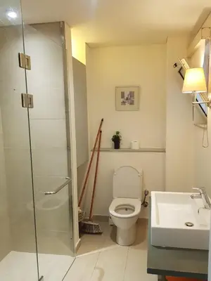 a bathroom with a shower and a toilet and a sink at شقه غرفتين وصاله بالحديقه في فراندا سهل حشيش in Hurghada