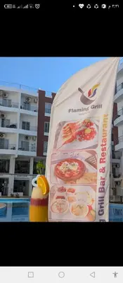 a sign for a restaurant with a picture of pizza at One bedroom apartment in Aqua palm resort before Al Gouna in Hurghada