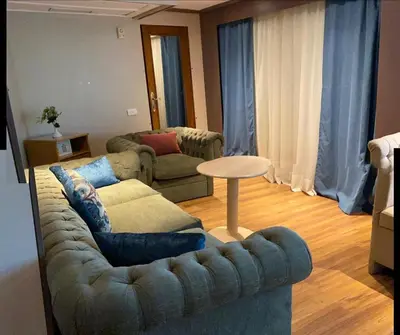 a living room with a couch and a table at Nile Cruise Aswan & Luxor & Abu Simbel in Luxor