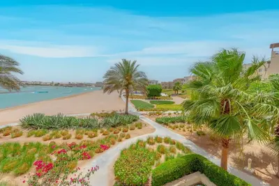 an aerial view of a park with palm trees and a beach at Peaceful 2-Bedroom in Waterside, El Gouna. Pool & Lagoon in Hurghada