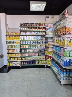 a grocery store aisle with a lot of food and drinks at Studio Apartment in Hurghada