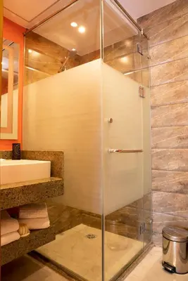a bathroom with a shower and a sink at Al Dora Residence Suites Hurghada in Hurghada
