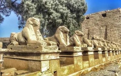 a stone statue of lions sitting on a wall at Royal Home Luxor Nile View in Luxor