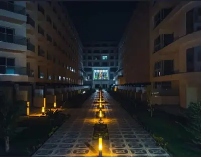 an empty hallway of a building at night at Scandic Resort - Mido Chalet in Hurghada