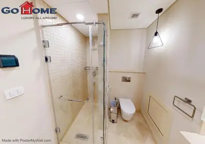 a shower stall in a bathroom with a toilet at Stylish 1BR-Pool View M7-6B at Mangroovy El-Gouna in Hurghada
