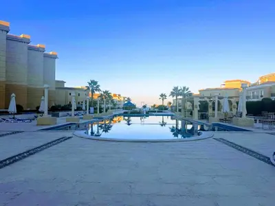 a courtyard at a resort with a pool at 2 Bed Flat - Sleeps 6 - Pool - Parking - Wifi in Hurghada