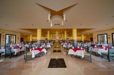 a banquet hall with tables and chairs in a restaurant at Lemon & Soul Makadi Garden in Hurghada