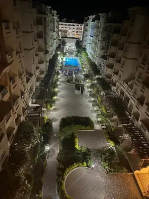an aerial view of an apartment complex at night at Benashti Hurghada apartment in Hurghada
