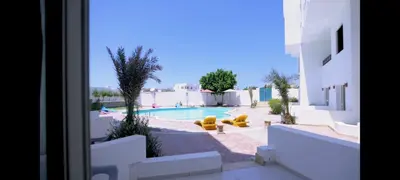 a view of a swimming pool from a building at La bonita compound for rent in Hurghada