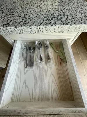a drawer under a table with a counter top at Azzurra two-bedrooms apartment at Sahl Hasheesh in Hurghada