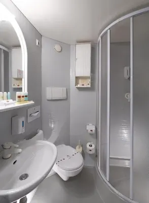 a white bathroom with a sink and a shower at Iberotel Amara Nile Cruise - Every Thursday from Luxor for 07 & 04 Nights - Every Monday From Aswan for 03 Nights in Luxor