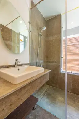a bathroom with a sink and a mirror at Modern & Comfy 2BR in Bali, El Gouna. Private Patio & Pool in Hurghada