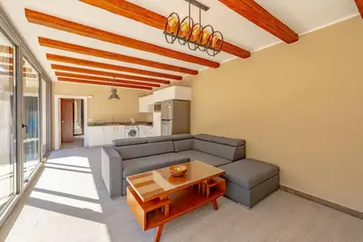a living room with a couch and a table at Modern & Comfy 2BR in Bali, El Gouna. Private Patio & Pool in Hurghada