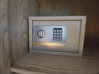 a microwave in a room with a wooden wall at Scandic resort 547 in Hurghada