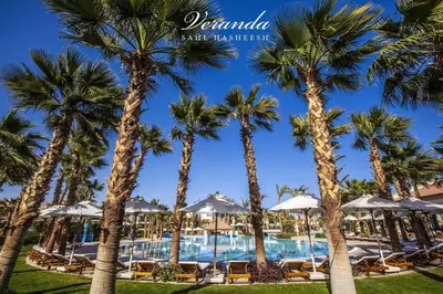 a resort with palm trees and a pool at veranda sahl hasheesh in Hurghada