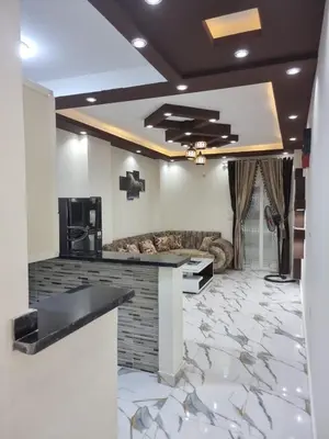 a lobby with a marble floor and a bar in a room at Coral House in Hurghada