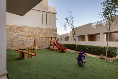 a yard with a playground in a building at Creek Hotel and Residences El Gouna in Hurghada