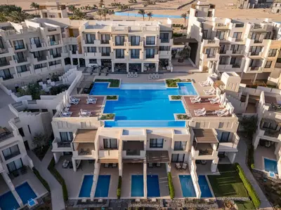 an aerial view of a resort with a swimming pool at Creek Hotel and Residences El Gouna in Hurghada