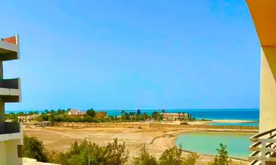 a view of the beach from a building at Sea view Apartment in Hurghada