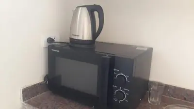 a blender sitting on top of a microwave at Hurghada-Magawish Studio 2 in Hurghada