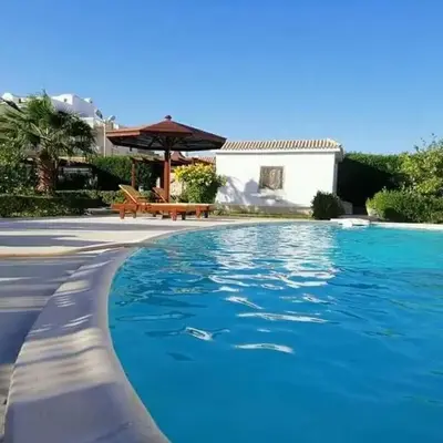 One room in a compound with the swimming pool
