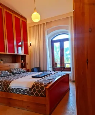a bedroom with a bed and a large window at West golf 2bedroom in Hurghada