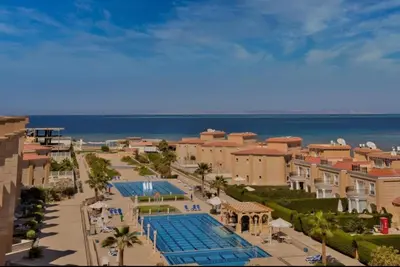 an aerial view of a resort with a swimming pool at SELENA BAY RESORT WITH PRIVATE BEACH,SEA VIEw in Hurghada