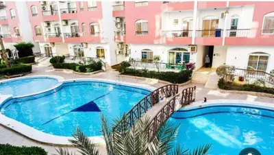 a large swimming pool in front of a building at وحدة فندقية سياحية بكمبوانداند وسط الغردقة in Hurghada