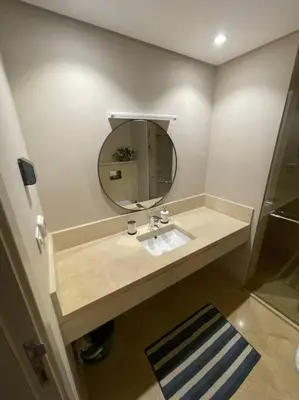 a bathroom with a sink and a mirror at Mangroovy- Sensational 1BR Sea & Kite view in Hurghada