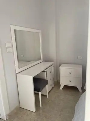 a white desk with a mirror and a chair at Royal Nile Villas - Luxury Nile View Apartment 2 in Luxor
