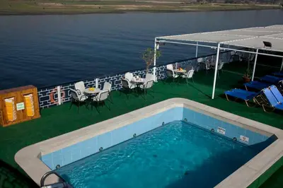 a swimming pool on the deck of a cruise ship at Iberotel Helio Nile Cruise - Every Monday from Luxor for 07 & 04 Nights - Every Friday From Aswan for 03 Nights in Luxor