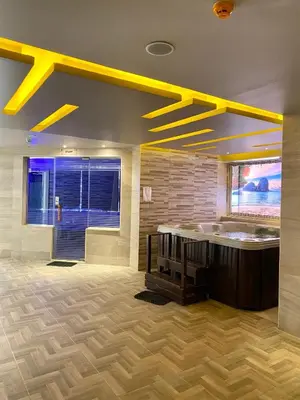 a large bathroom with a tub and a large window at Apartment in el karma aqua beach resort hurghada near El gouna in Hurghada