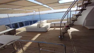 a boat deck with a couch and chairs on it at KUBA LuXus tour - Hotel boat in sahl Hashesh - Hurghada in Hurghada