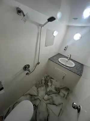 a small bathroom with a toilet and a sink at KUBA LuXus tour - Hotel boat in sahl Hashesh - Hurghada in Hurghada