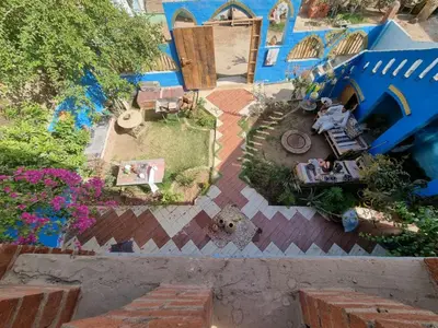 an overhead view of a miniature garden with a house at Golden Palace Family in Luxor