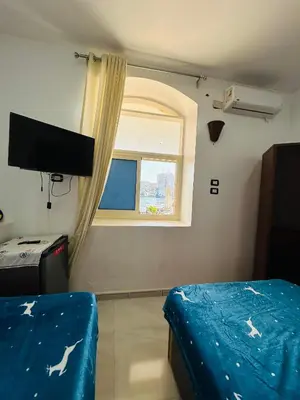 a room with a bed and a window at ANA-KA Guest house in Aswan