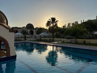 a swimming pool with the city in the background at Elphardous Oasis Hotel in Luxor