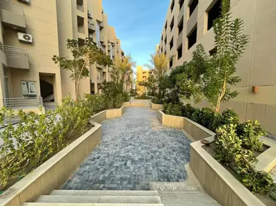 a cobblestone street in a city with buildings at Cozy Studio With Private Beach ! in Hurghada
