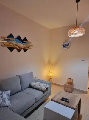 a living room with a couch and a table at Tolles Modernes Studio in Aldau in Hurghada