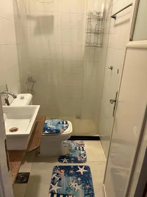 a bathroom with a toilet and a sink at The House Of Love in Luxor